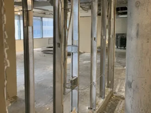 Exposed metal studs in an office partition