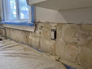 Kitchen backsplash area after tile removal