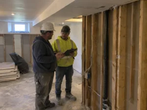 Workers reviewing an interior removal plan