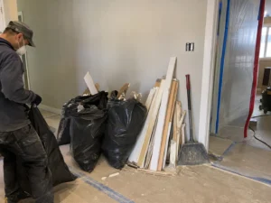 Collected debris beside retained wall finishes