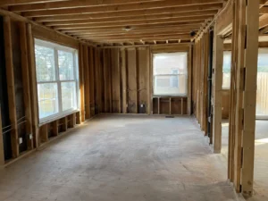 Cleared residential room with exposed timber framing